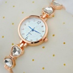Fashion lady watch with stone on metal strap